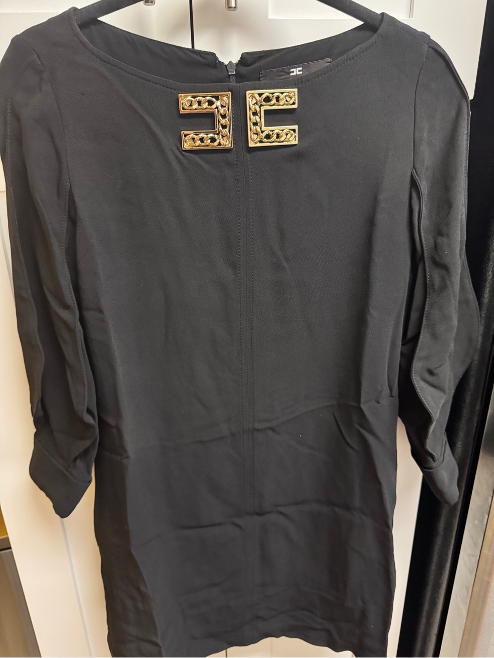 Black Shift Dress with Gold Chain Accent